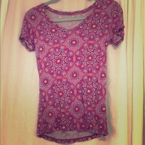 A maroon colored short-sleeved Shirt